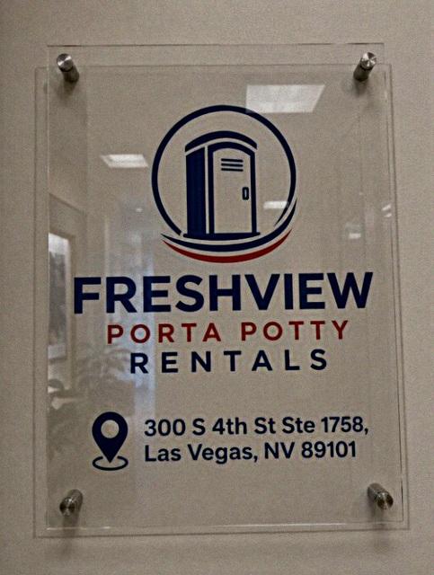 Freshview Porta Potty Rentals sign inside the downtown Las Vegas office